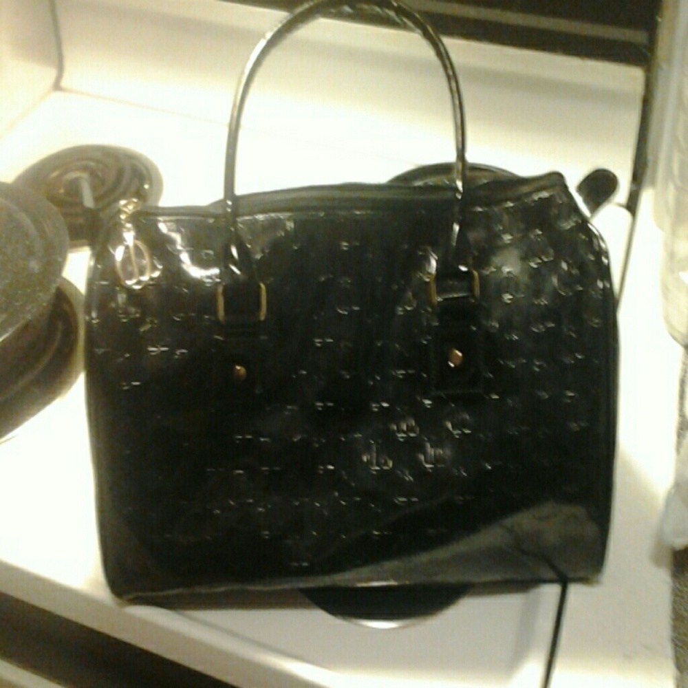 A all black Queen Latifa purse
